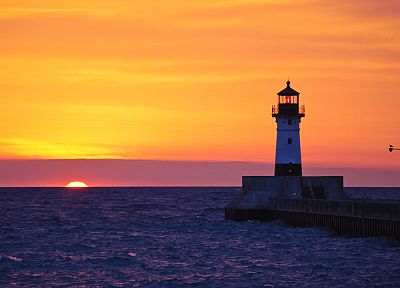 sunset, ocean, lighthouses - random desktop wallpaper