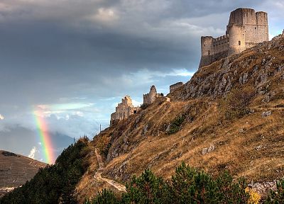 sunset, mountains, clouds, landscapes, nature, Sun, castles, ruins, skylines, grass, fields, rainbows, skyscapes - related desktop wallpaper