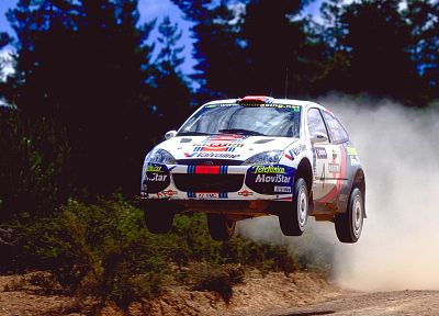 cars, dust, rally, racing, Colin McRae, races, rally cars, gravel, Ford Focus WRC, racing cars, rally car, jump - desktop wallpaper